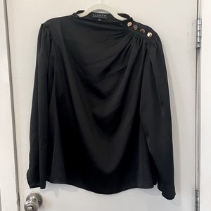 Black satin shirt with gold button detail.